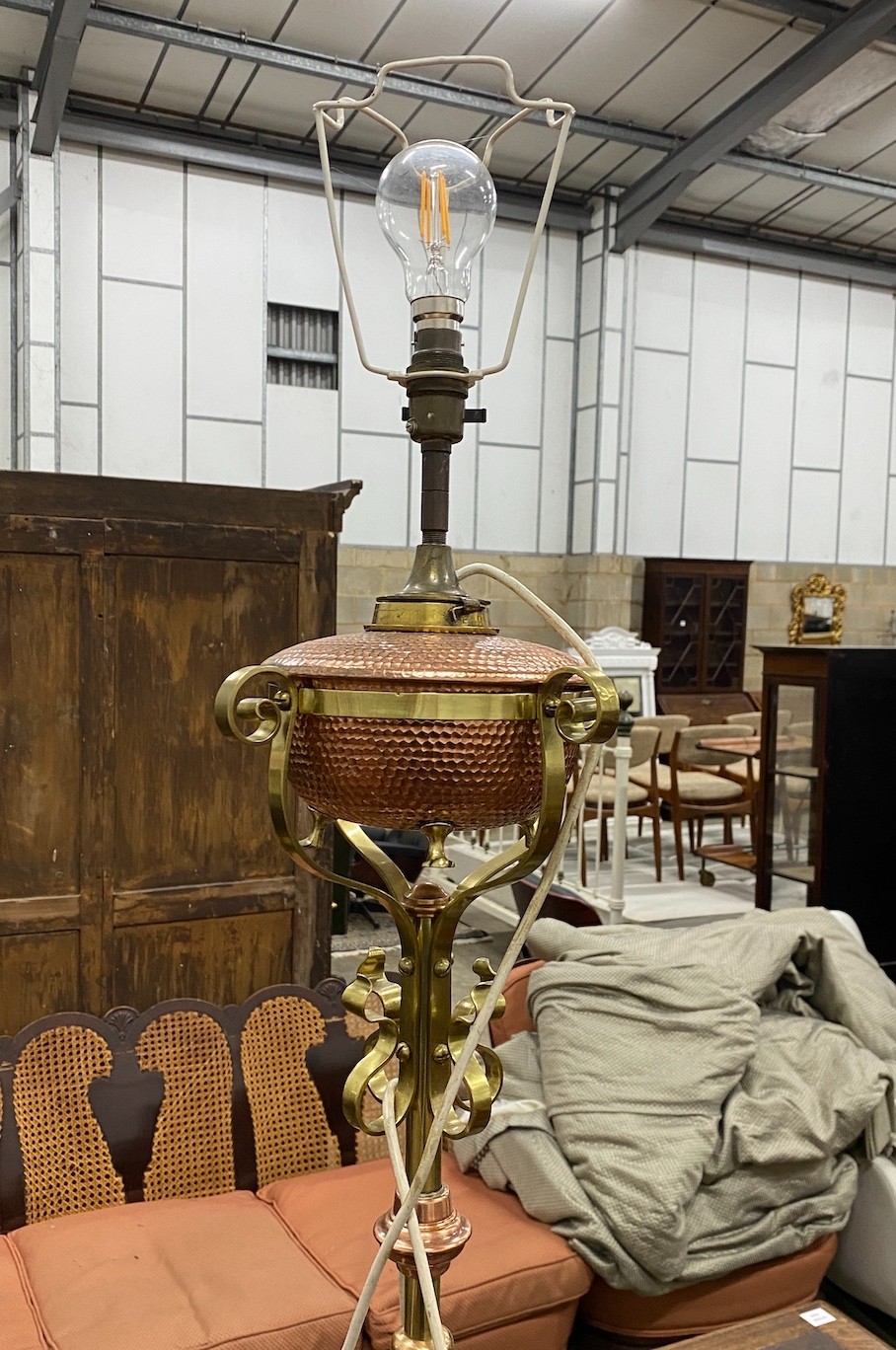 An Art Nouveau brass and copper telescopic oil standard lamp converted to electricity